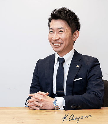 代表　青山敬次郎